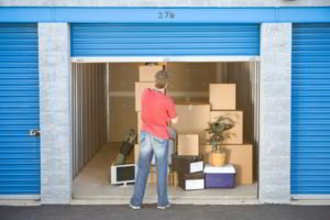 man closing storage unit