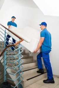 men lifting couch