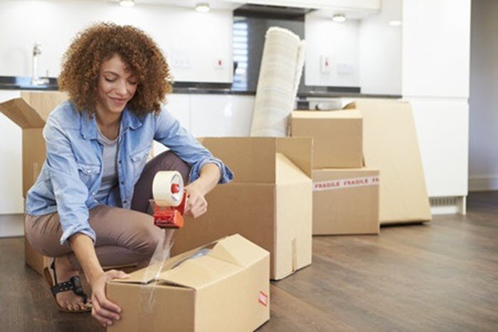 woman packing boxes